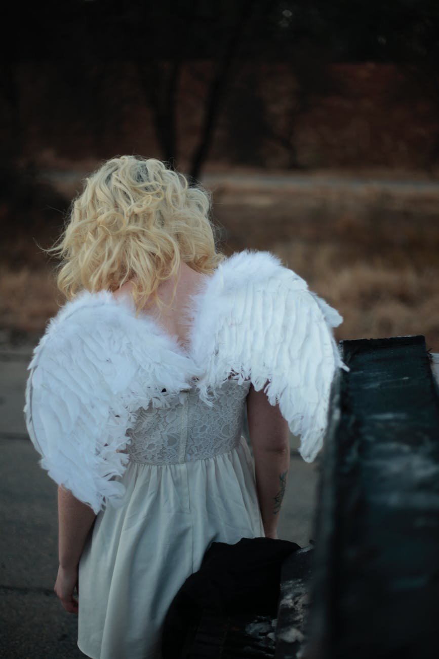 woman wearing wings